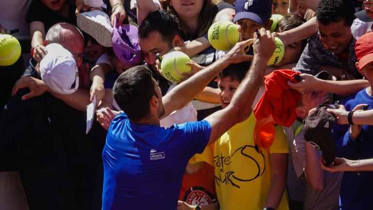 Djokovic returned the positive energy directed his way in flashing smiles back.