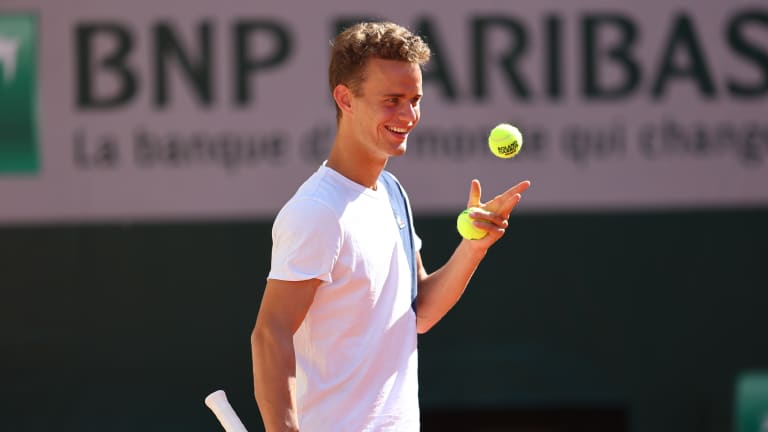 Van Assche played his first major main-draw at this year's Australian Open (l. to Norrie).