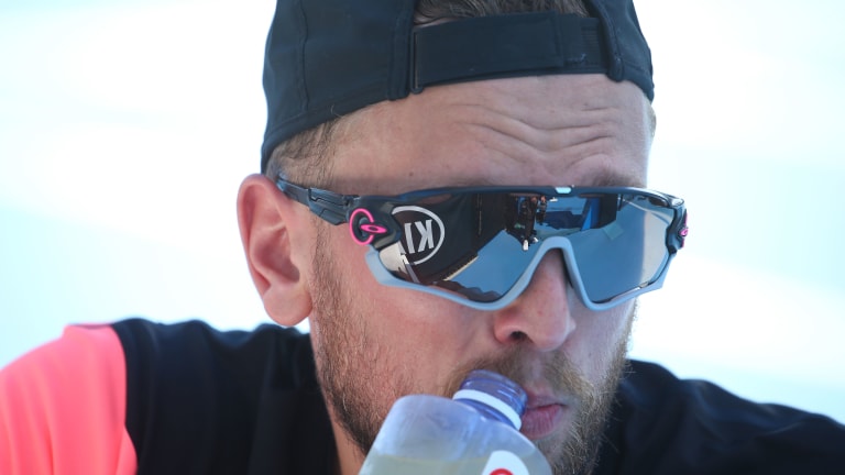 Alcott sipping a mid-match refreshment, at the 2018 Australian Open.